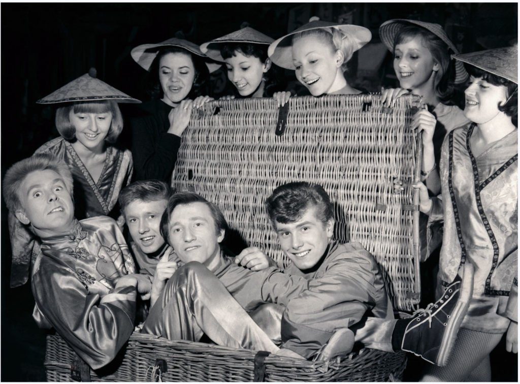 Howard with the Bruvvers and other-cast-members appearing in Aladdin